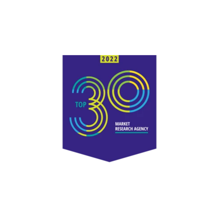A badge with the text "Top 30 Market Research Agency 2022" printed on a purple background with a colorful circular design, celebrating excellence in market research and data collection.