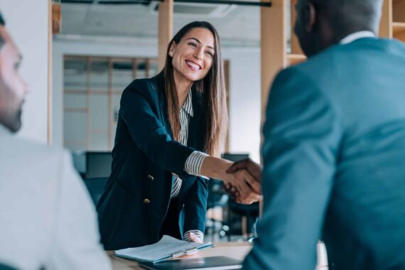 man and woman shaking hands.